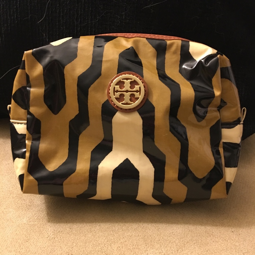 Patent leather Tory Burch makeup bag.